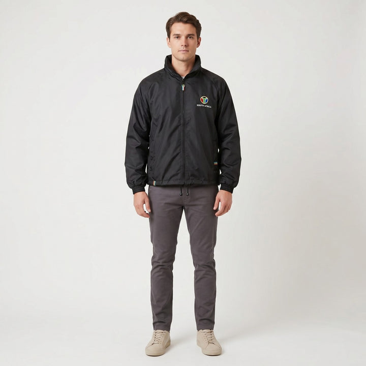 Black Drimac jacket, front view, featuring a zippered closure and colorful &