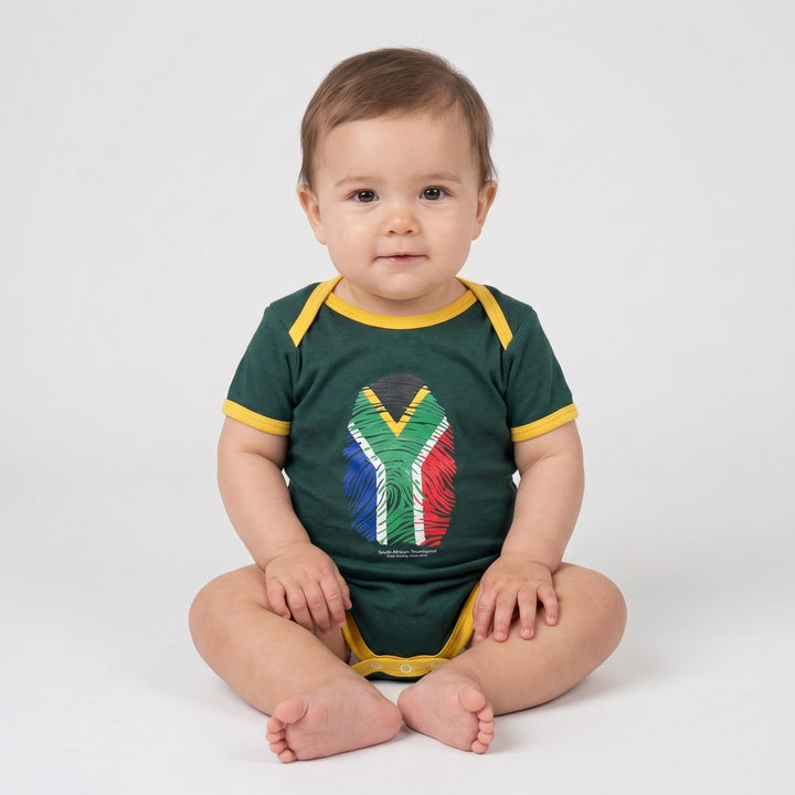 Dark green baby Winter Grower romper with yellow trim and a colorful South African flag fingerprint graphic on the front,