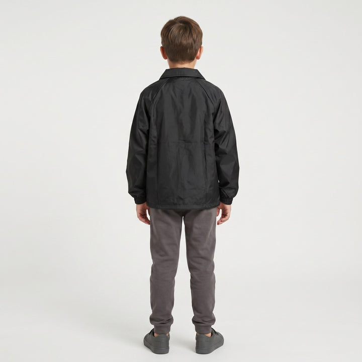 Back view of a black Drimac jacket made from lightweight, slightly crinkled fabric, featuring black drawstrings at the hem.