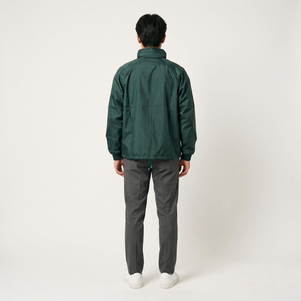 Dark green Drimac jacket, made of smooth, wind-resistant fabric, shown from the back view. Features ribbed cuffs and an