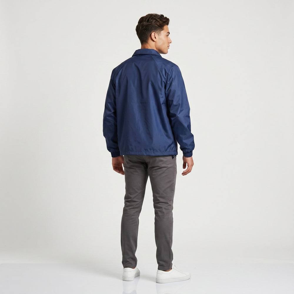 A navy blue Drimac jacket, viewed from the back, showcasing its smooth fabric, long sleeves, and relaxed fit. Ideal for