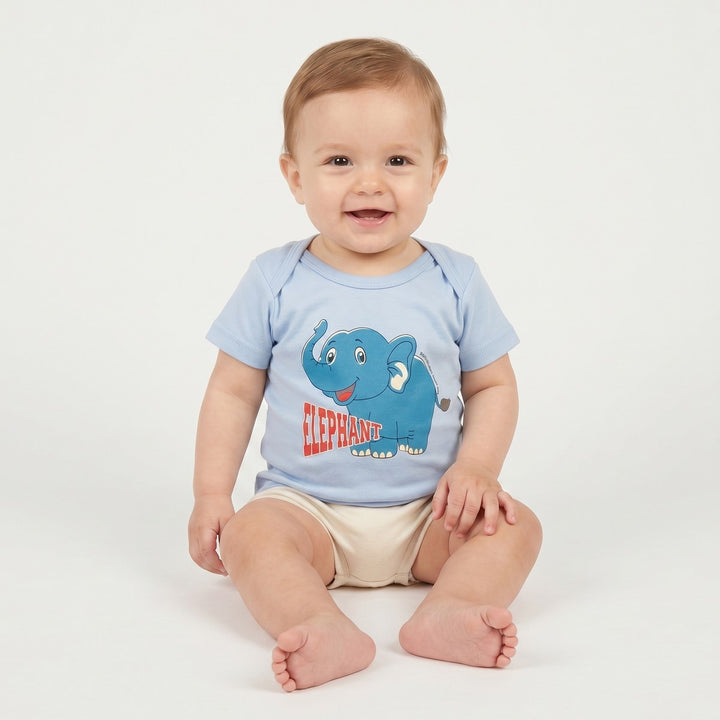 A smiling baby wears a light blue short-sleeve t-shirt featuring a cheerful cartoon blue elephant and red &