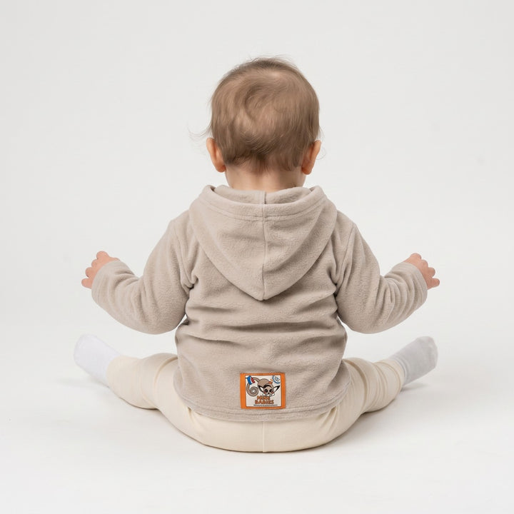 Stone beige fleece hoodie with a long-sleeved design, viewed from the back, featuring a distinctive penguin logo patch.