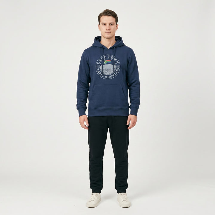 Navy blue hooded sweatshirt featuring a "Cape Town Table Mountain" graphic with the South African flag, laid flat.