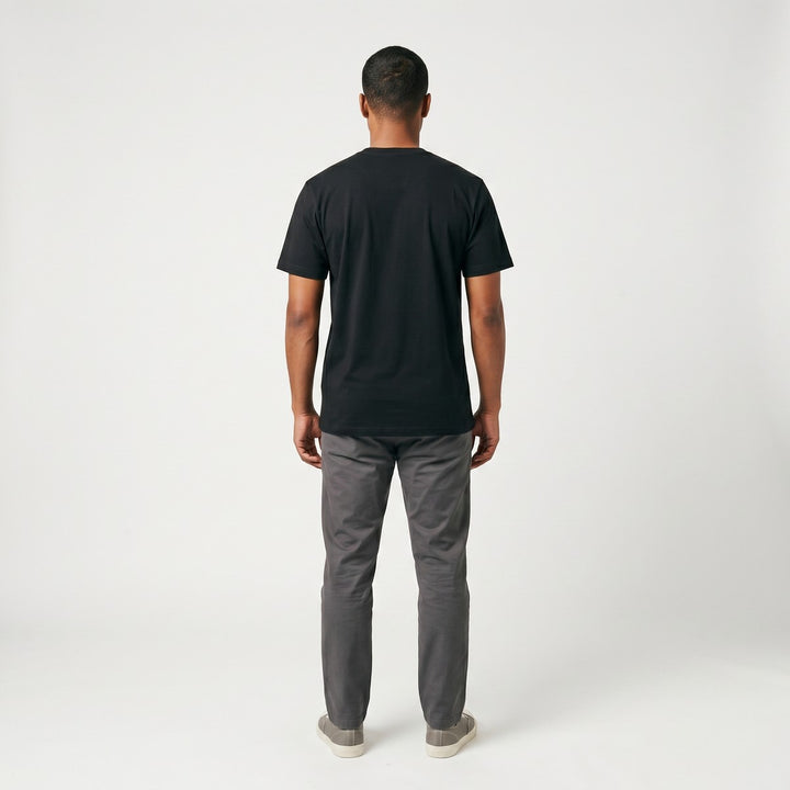 Black SA Flag T-Shirt, back view, made from soft cotton fabric, laid flat on a white surface.
