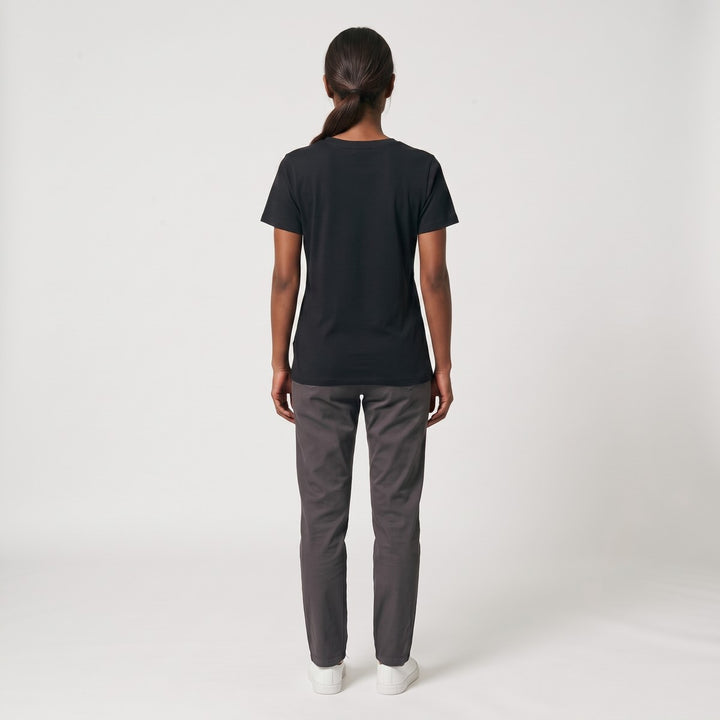Back view of a black SA Flag T-Shirt with short sleeves, showcasing the fabric and fit on a standing model.
