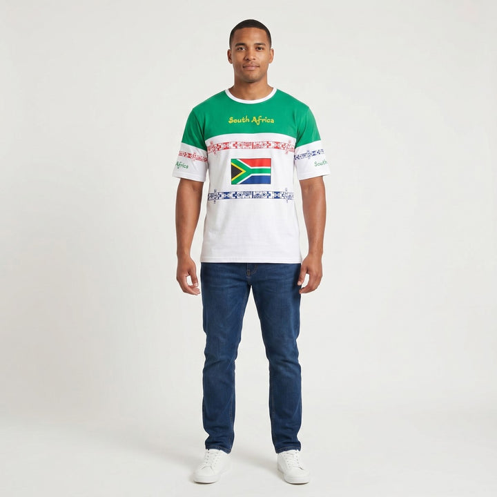 SA Green White T-Shirt with "South Africa" text, a South African flag graphic, and red and blue geometric patterns, front