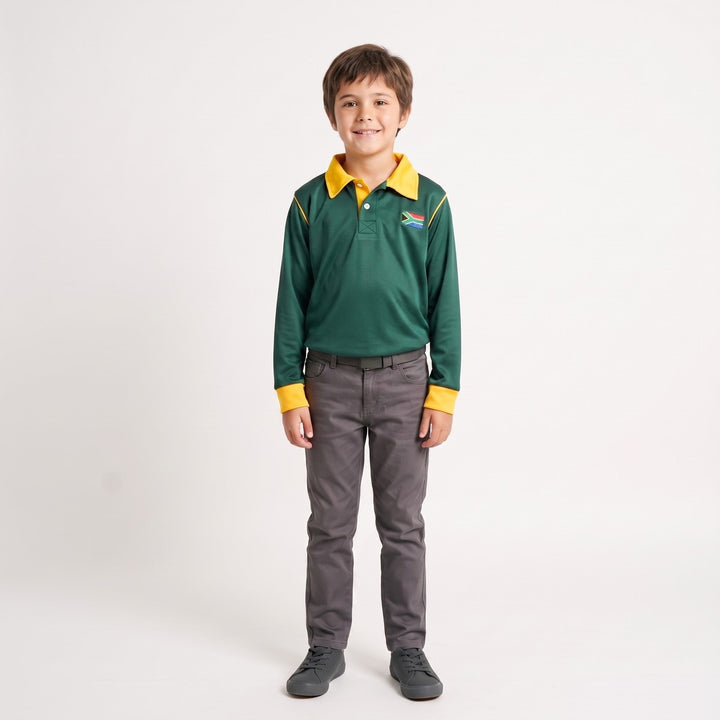 Boy wearing a green long-sleeve Thumbprint Golfer polo shirt with yellow collar and cuffs, featuring a South African flag