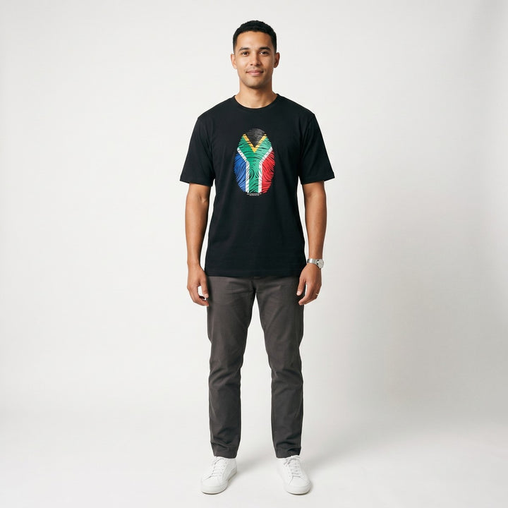 Black short-sleeved Thumbprint T-Shirt featuring a vibrant South African flag fingerprint graphic on the front, displayed