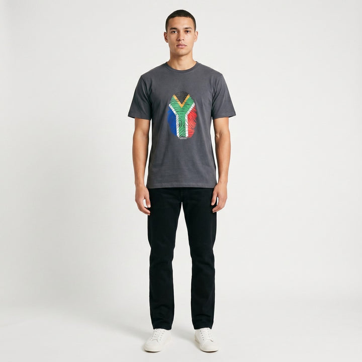 A charcoal grey short-sleeve Thumbprint T-Shirt featuring a vibrant South African flag fingerprint graphic on the front.