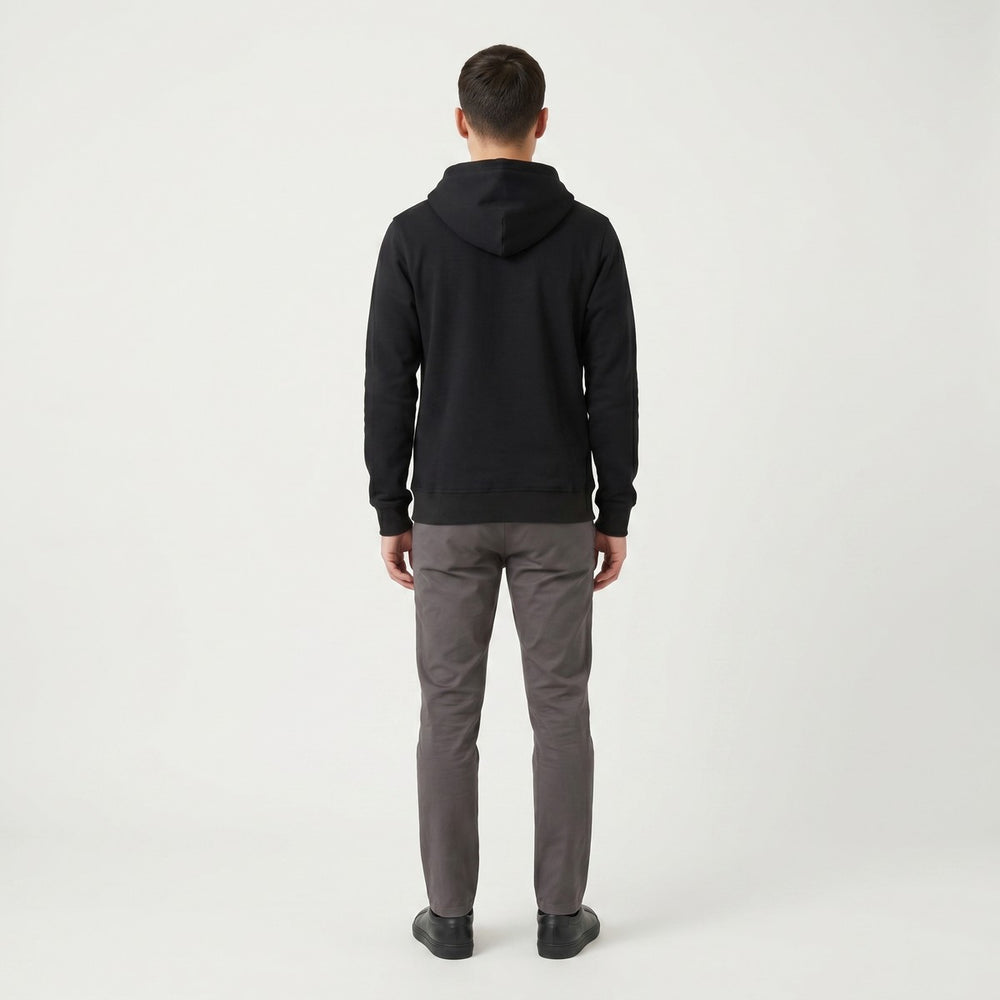 Back view of a Tribal Black Hoodie, showcasing its soft black fabric and comfortable hooded design, laid flat.