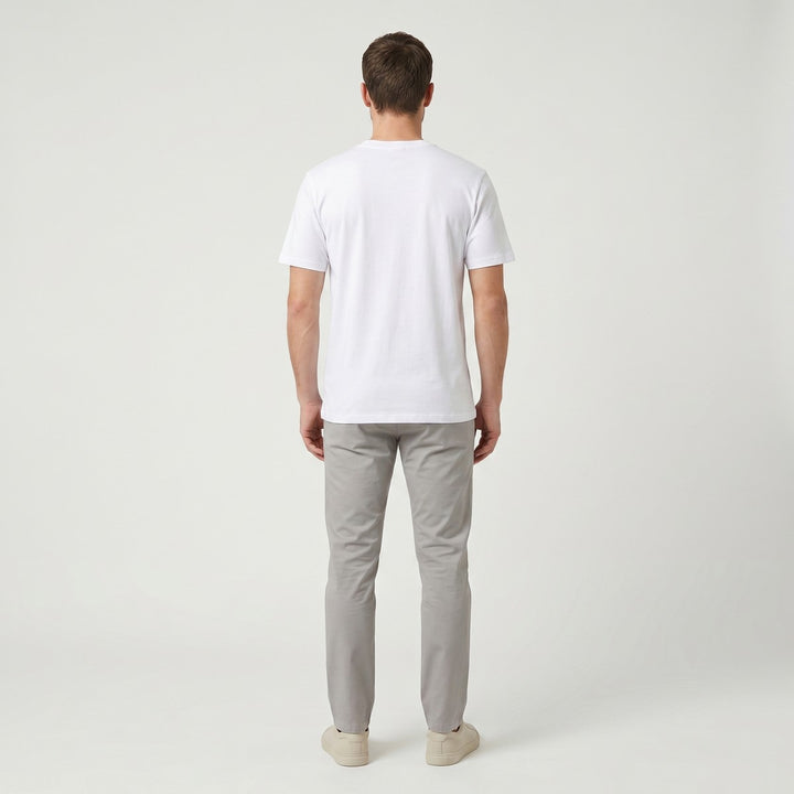 Back view of a plain white short-sleeve Word T-shirt made from a smooth cotton blend fabric, photographed on a table.