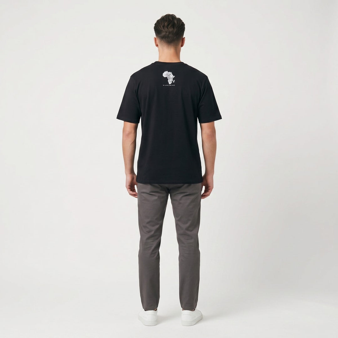Back view of a black Zebra T-shirt, featuring a distinct white zebra-striped Africa map graphic on the upper back, laid flat.